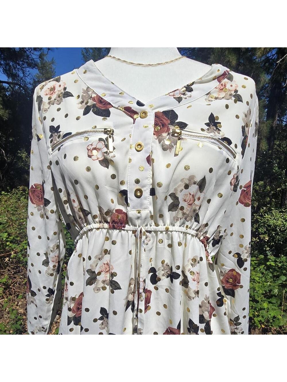 Floral and polka dot print blouse with zipper details.
